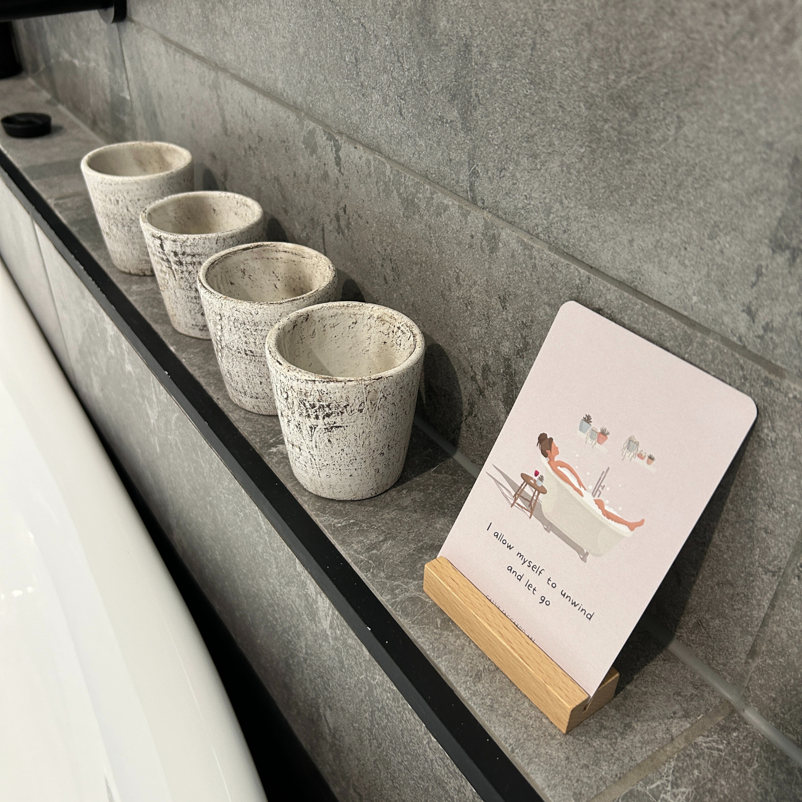 Daily affirmation card deck with wooden stand for self-care on bathtub