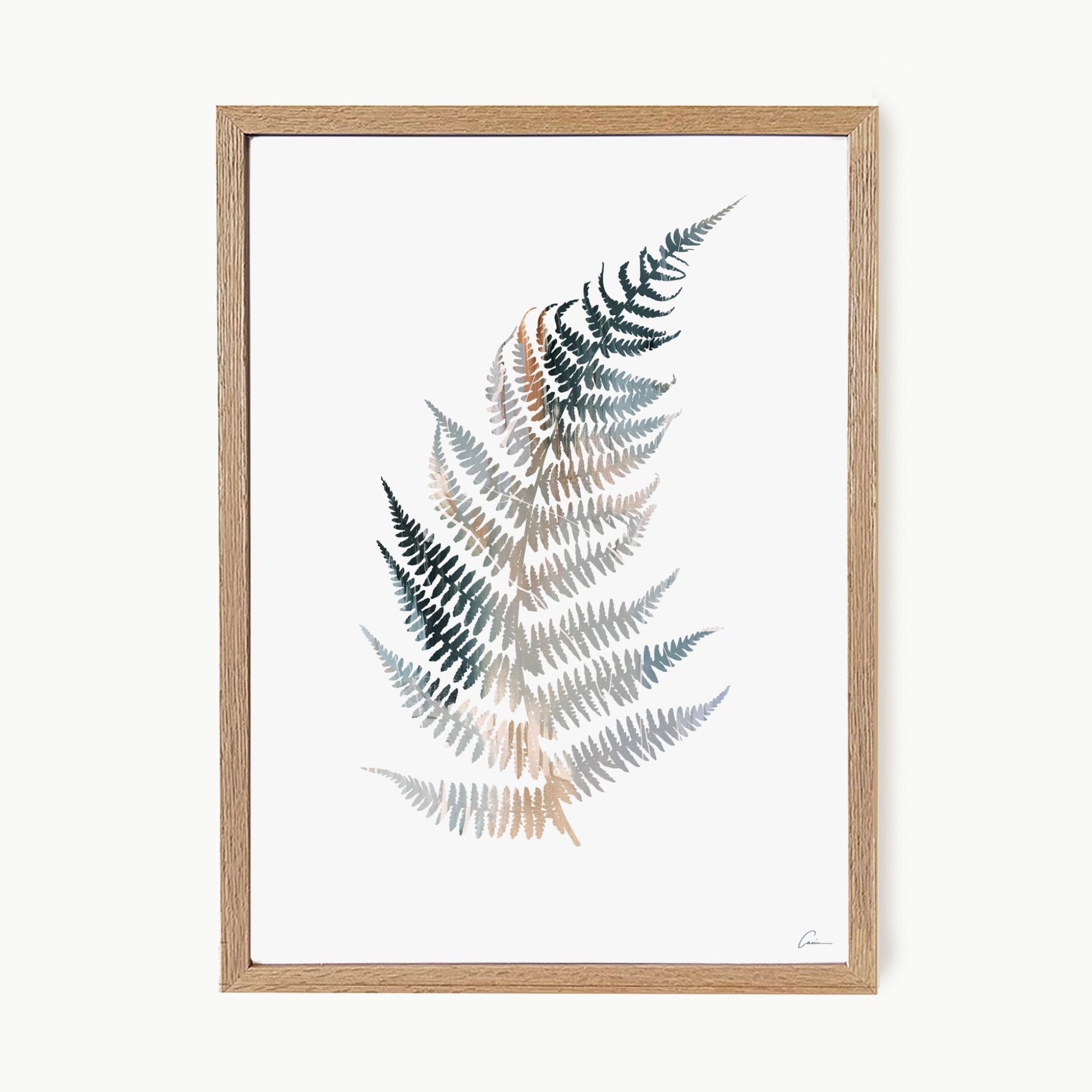 Framed artwork of a fern leaf with a wooden frame on a white background