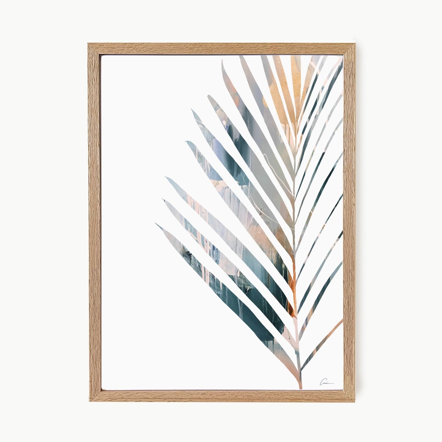 Framed artwork of a palm leaf with a wooden frame on a white background